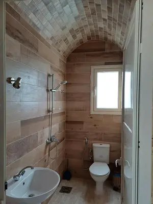 a bathroom with a toilet and a sink at Sunny sea in Quseir