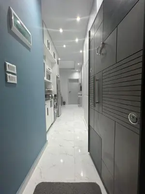 a hallway of a kitchen with a tile floor at BS Lodging 16- Next to Dream Beach in Hurghada