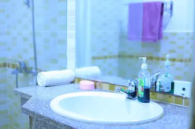 a bathroom counter with a sink and a mirror at Sun Of Marina in Hurghada