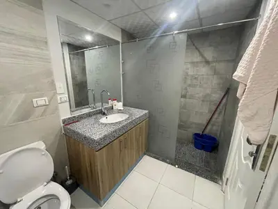 a bathroom with a sink and a toilet at Scandic 1 in Hurghada