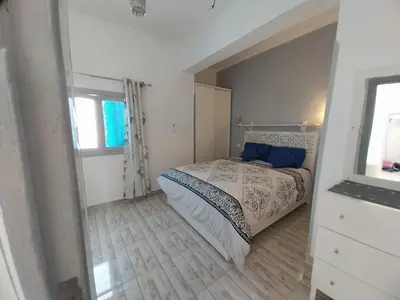 a small bedroom with a bed and a window at desert pearl beautiful cosy new home in Luxor