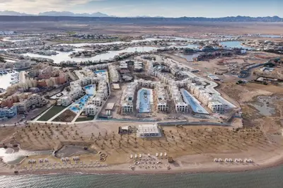 an aerial view of a resort on the beach at Proper & Plush 1 BDR Mangroovy Free Pool & Beach Access in Hurghada