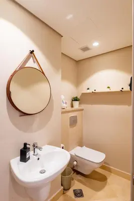 a bathroom with a sink and a mirror at Seascape 1 BDR Mangroovy Pool & Sea View in Hurghada