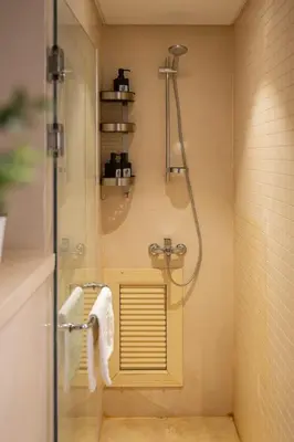 a shower in a bathroom with a glass door at Seascape 1 BDR Mangroovy Pool & Sea View in Hurghada