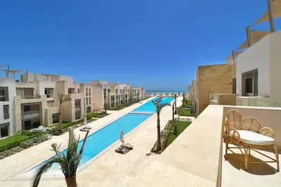 a view from the balcony of a apartment with a swimming pool at Seascape 1 BDR Mangroovy Pool & Sea View in Hurghada