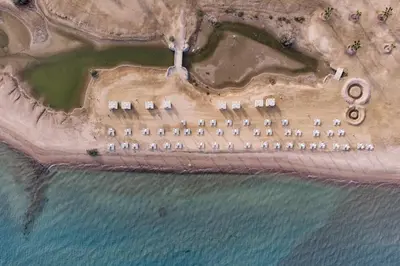 an aerial view of a resort on the beach at Charming 2BDR w Sea & Pool View Free Beach & Pool Access in Hurghada