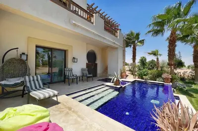 a house with a swimming pool in a yard at Meditative & Blissful 2 BDR Villa Ancient Sands Private Pool in Hurghada