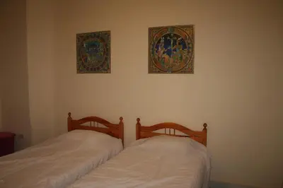 two beds sitting next to each other in a bedroom at A Beautiful, Family-owned Penthouse Apartment, Overlooking the Red Sea Hurghada in Hurghada