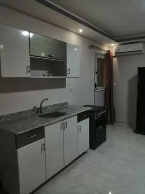 a kitchen with a sink and a counter top at 402 A in Hurghada