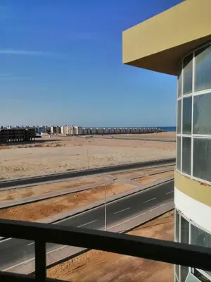 a view of the beach from the window of a building at 403 A in Hurghada