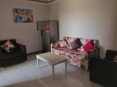 a living room with a couch and a table at 403 A in Hurghada