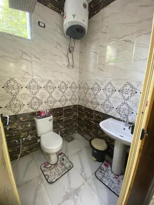 a bathroom with a toilet and a sink at Sunrise shiny Nubian Guest House in Aswan