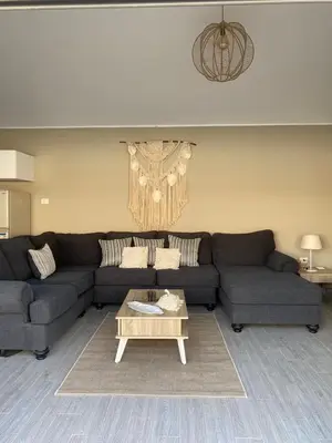 a living room with a couch and a coffee table at 2 Bedroom villa with private heated pool in Gouna in Hurghada