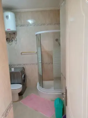 a bathroom with a shower and a toilet and a sink at Hurghada Red Sea in Hurghada