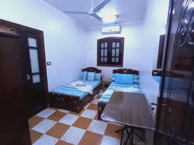 a room with a table and a table and chairs at Aswan City Center Guest House in Aswan