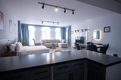 a kitchen and living room with a couch and a table at El Gouna Elite Worldwide Sea & Garden Residences - Hurghada, Egypt in Hurghada