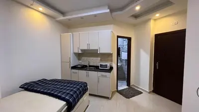 a small kitchen with a bed in a room at Casablanca beach resort, first line, with private beach and swimming pools,hurghada in Hurghada
