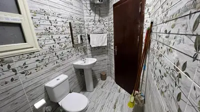 a bathroom with a toilet and a sink at Casablanca beach resort, first line, with private beach and swimming pools,hurghada in Hurghada