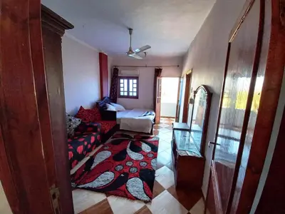 a living room with a couch and a table at Lucky House in Luxor