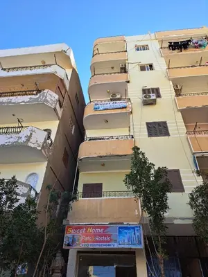 a tall building with balconies on the side of it at Sweet Home-ممنوع للمصرين Open 24 Hour in Hurghada