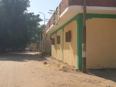 an empty street in front of a building at النبلاء جيست هاوس نوبيان اسوان in Aswan