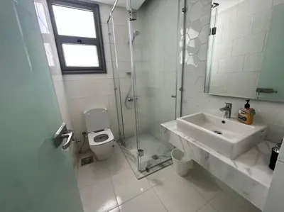 a bathroom with a sink and a shower and a toilet at 3bedroom apartment with a private pool in Hurghada