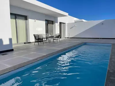 a swimming pool in front of a house at 2 bd with private heated pool in Sholan 2 El Gouna in Hurghada