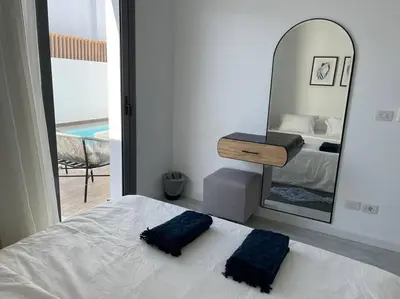 a bedroom with a bed and a large mirror at 2 bedroom with a private heated pool in Sholan2 in Hurghada