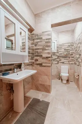 a bathroom with a sink and a toilet at Luxury private villa with pool in Hurghada