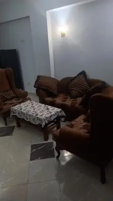 a living room with couches and a coffee table at New ikea flat 2 in Hurghada