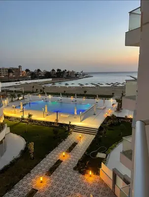 a view of the beach from the balcony of a building at شقة احلامك علي البحر in Hurghada