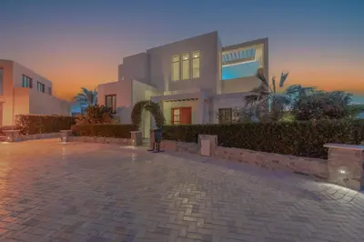 a building with a brick courtyard in front of it at Ascot Bay, Premium 5BR Lagoon Beach House & Pool in Tawila, El Gouna in Hurghada