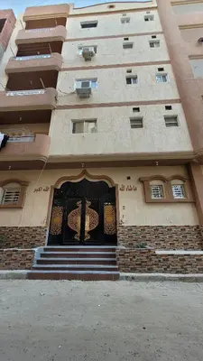 a building with a door with a cross on it at Ahmed House in Safaga