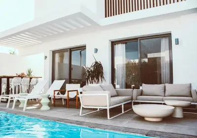 a villa with a swimming pool and a patio at Peaceful Villa 3BR at Sholan with Private Heated Pool in Hurghada