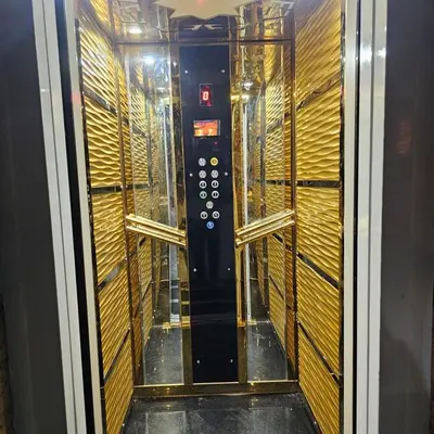 an empty elevator in a room with wooden walls at Susan's Guest House and Tours in Luxor