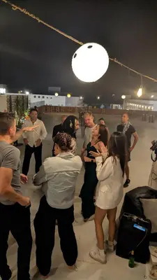 a group of people standing around in a room at Bedcoin Hostel in Hurghada