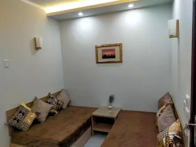 a living room with a couch and a table at شقة احلامك على البحر in Hurghada