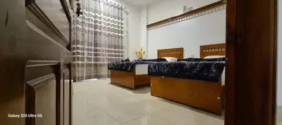 a bedroom with two beds and a window at Moon fourteen in Luxor