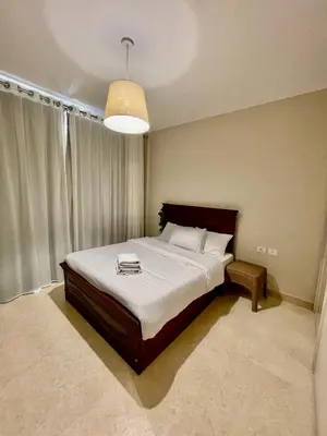 a bedroom with a large bed and a large window at Mangrove m3-1b-02 in Hurghada