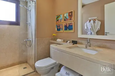 a bathroom with a sink and a toilet and a shower at BYTK - La Galería in Hurghada