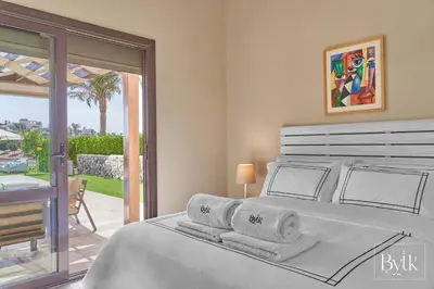 a bedroom with a bed with towels on it at BYTK - La Galería in Hurghada