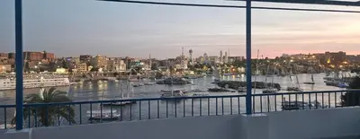 a view of a harbor with boats in the water at La Terrace in Aswan
