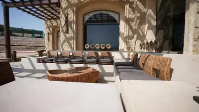 a group of chairs sitting on a patio at Amarina Jannah Resort & Aqua Park Marsa Alam in Coraya Bay
