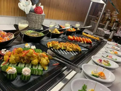 a buffet line with many different types of food at Amarina Jannah Resort & Aqua Park Marsa Alam in Coraya Bay