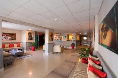 a lobby of a hospital with couches and chairs at Jawhara Inn Hotel - فندق الجوهرة سفاجا in Hurghada