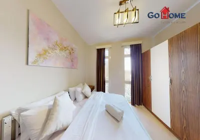 a bedroom with a white bed and a large window at Beautiful 2B. Rooms M7-4B Mangaroveey in Hurghada