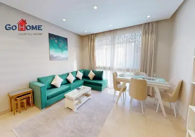 a living room with a green couch and a table at Beautiful 2B. Rooms M7-4B Mangaroveey in Hurghada