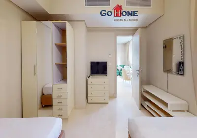 a bedroom with a bed and a tv in a room at Beautiful 2B. Rooms M7-4B Mangaroveey in Hurghada