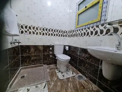 a bathroom with a toilet and a sink at Hurghada appartment one room front of dream beach in Hurghada