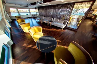 a living room with chairs and a table and a couch at ToBadaa - Nile cruise all inclusive from Aswan or Luxor 4 Days & 7 days in Aswan